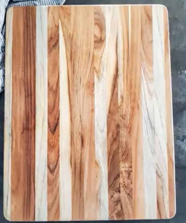 An empty wooden charcuterie board 