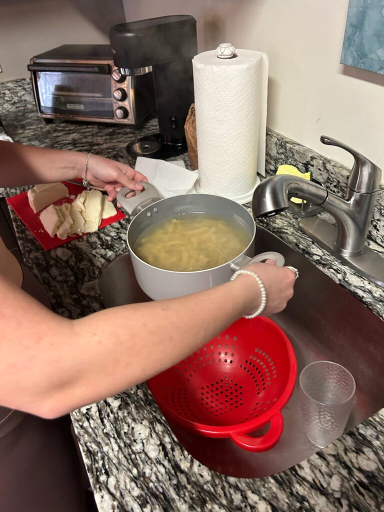 Straining water from pasta