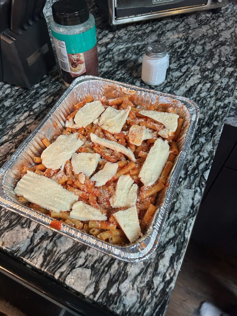 Grated cheese placed on top of the cheese slices